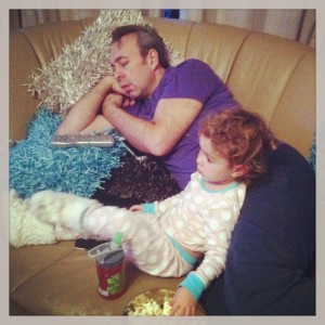 exhausted dad with toddler